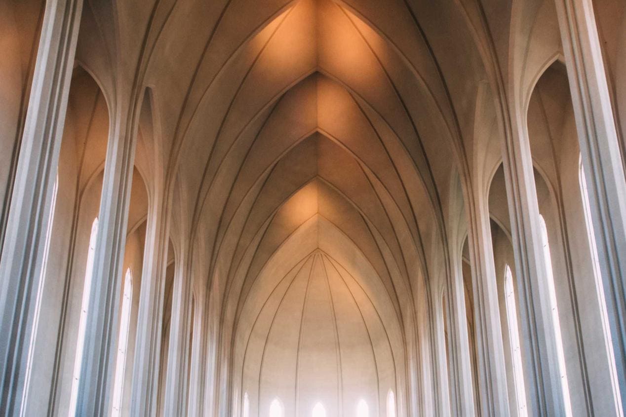 Interior of Hallgrímskirkja church with high vaulted ceiling.